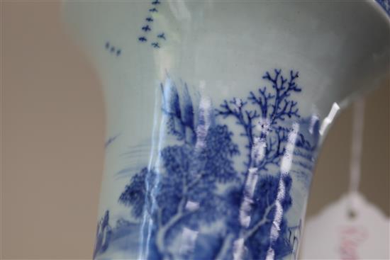 A Chinese blue and white beaker landscape vase, gu, Kangxi period, H. 30.5cm, lean to one side